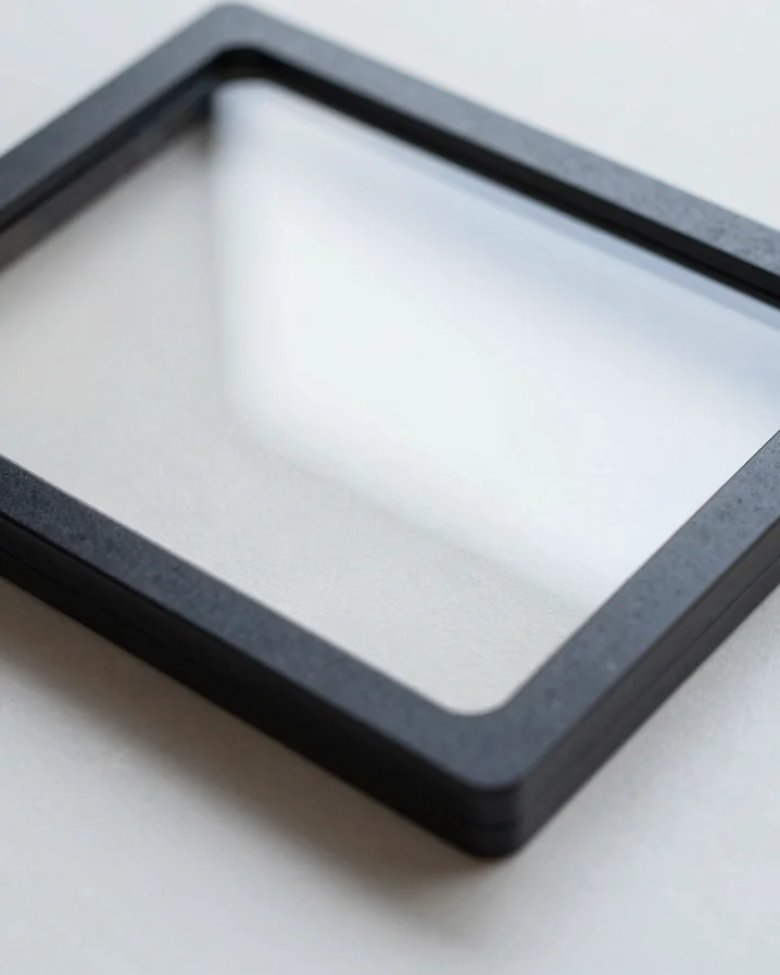 Editorial close-up of a tortoiseshell acetate frame resting on a